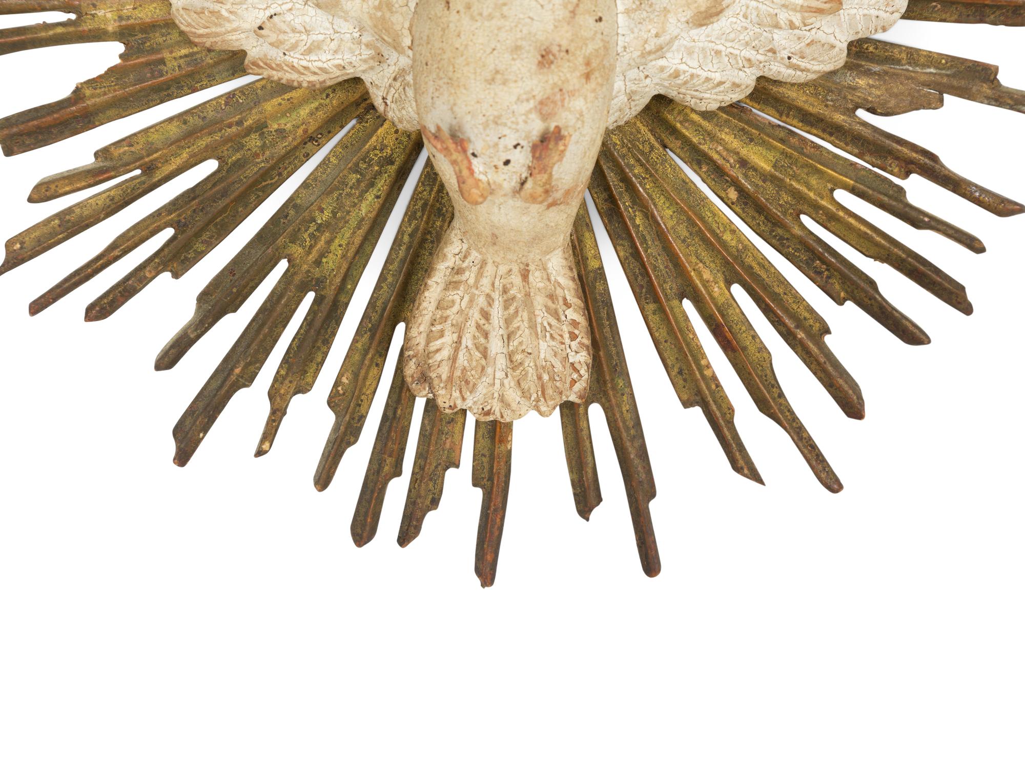 An Italian Carved and Painted Giltwood Dove on Sunburst