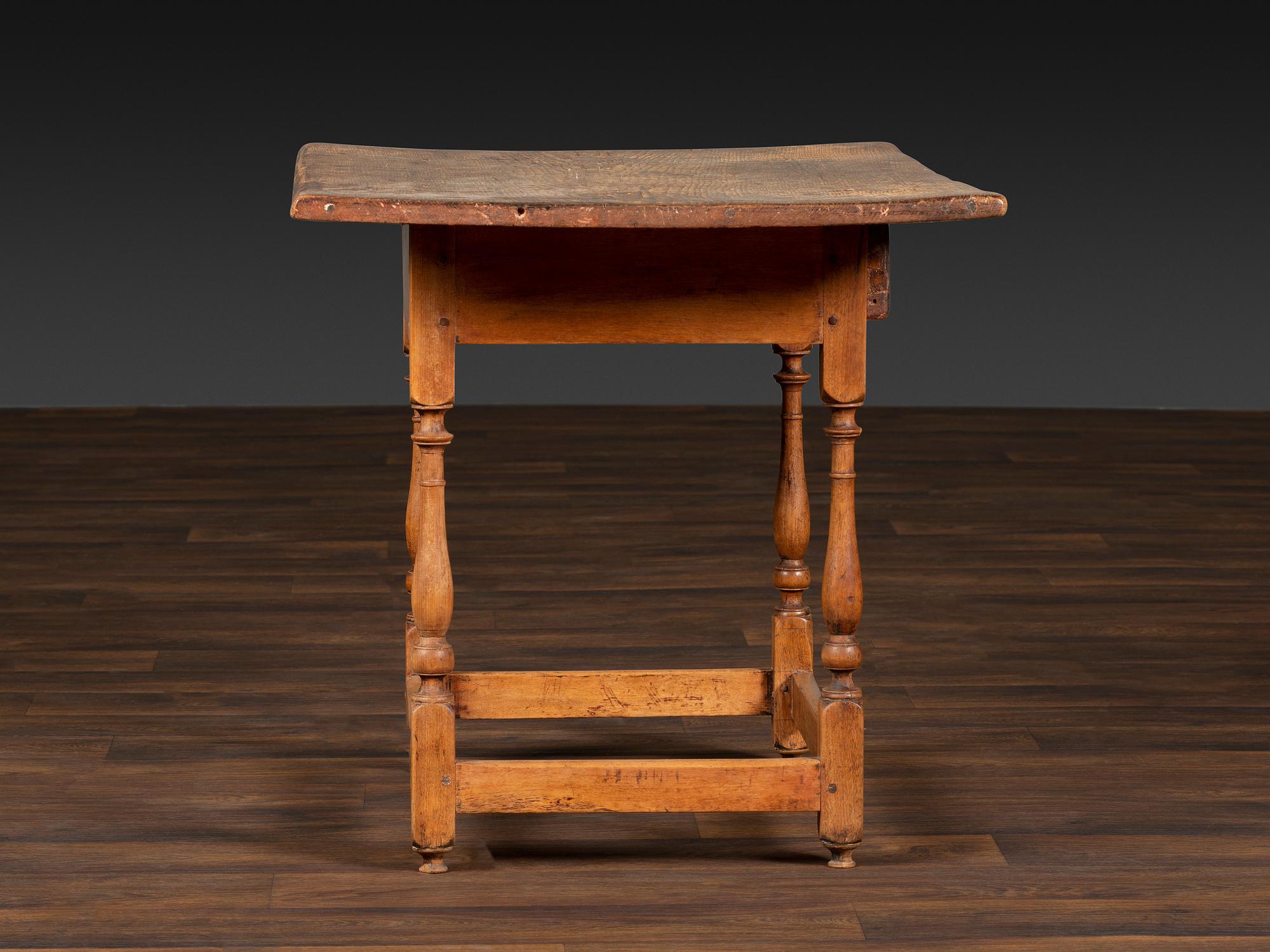 A William and Mary Pine and Maple Scrubbed Top Tavern Table