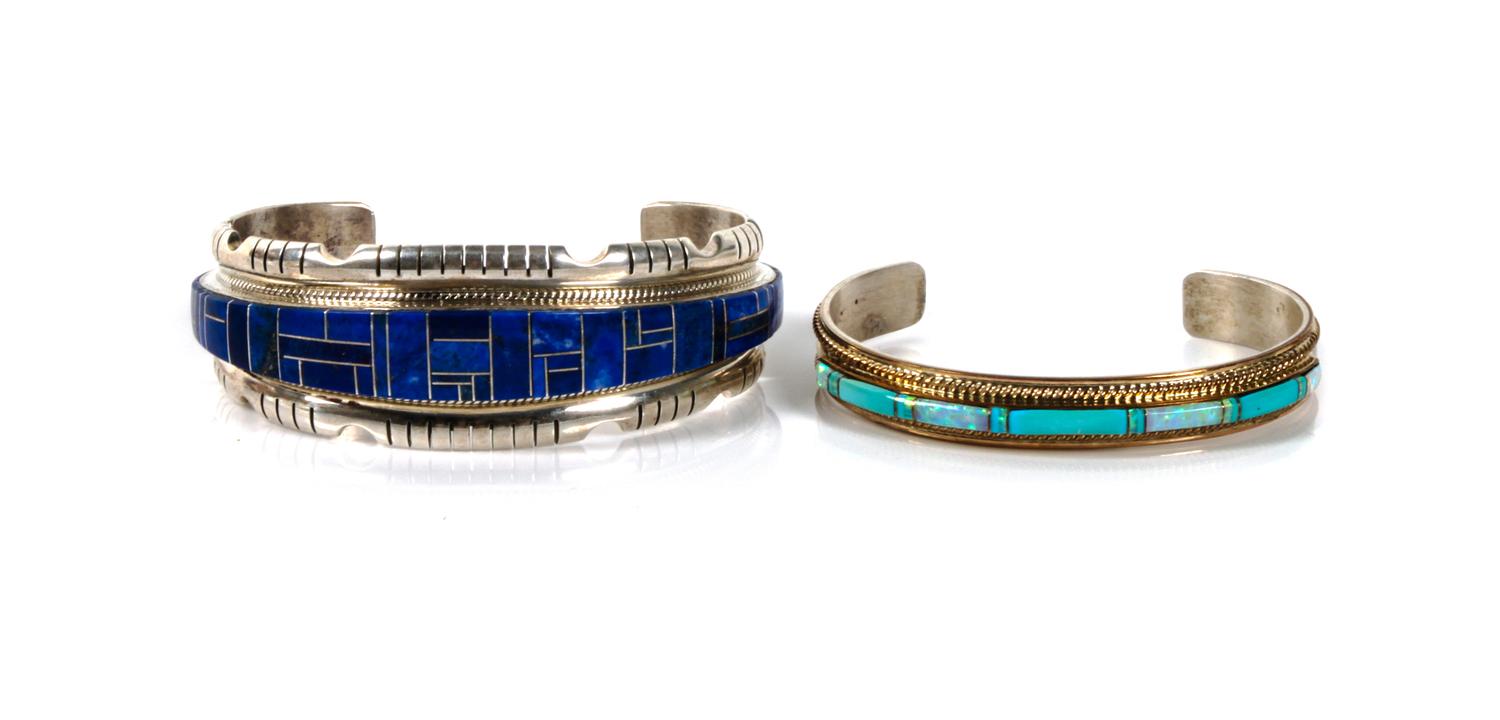 Two Southwestern Cuff Bracelets Length of largest 6 1/2 x opening 1 1/4 x width 1 inches.