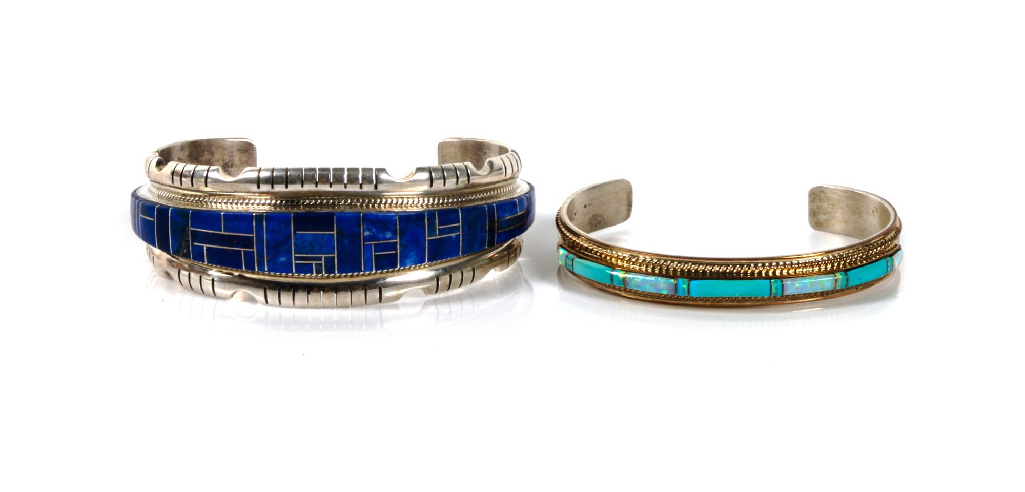 Two Southwestern Cuff Bracelets Length of largest 6 1/2 x opening 1 1/4 x width 1 inches.