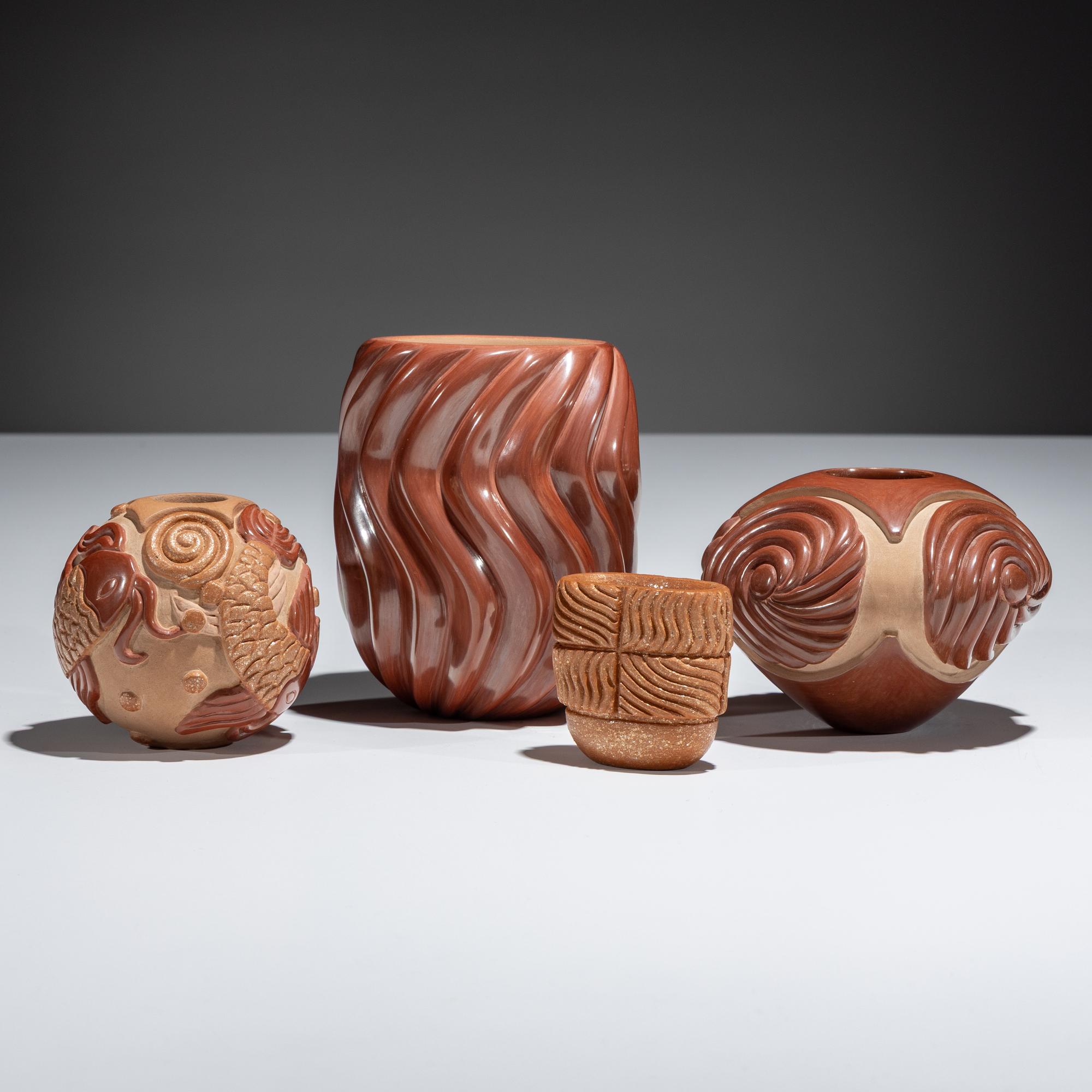 Red and Tan Carved Pottery