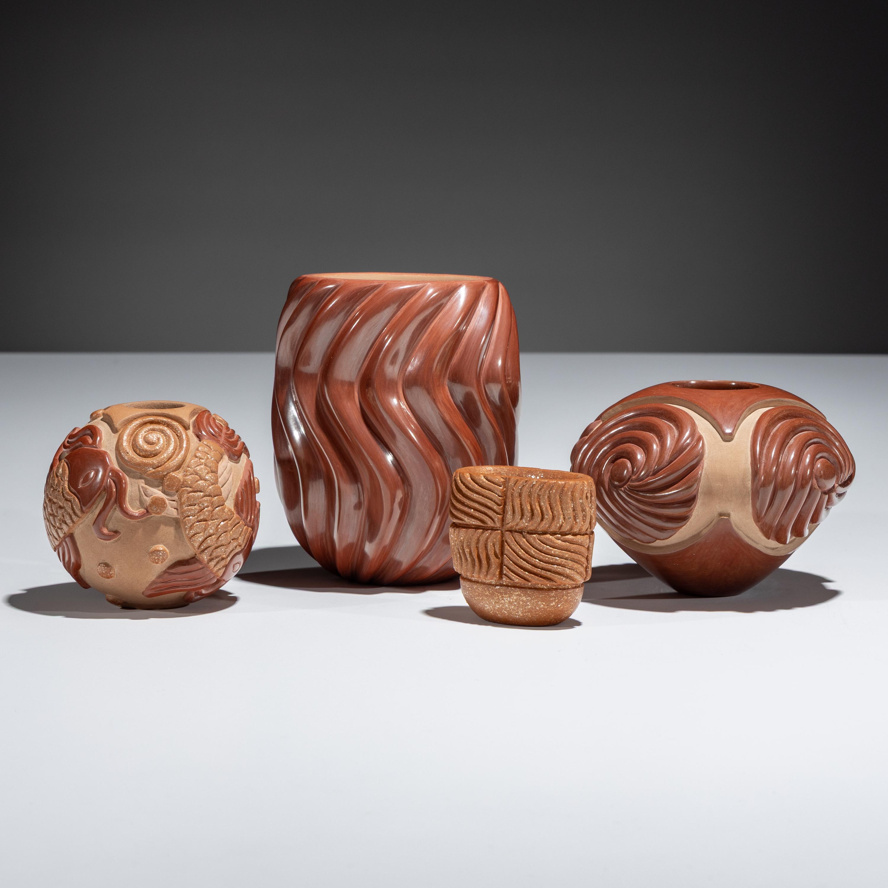 Red and Tan Carved Pottery