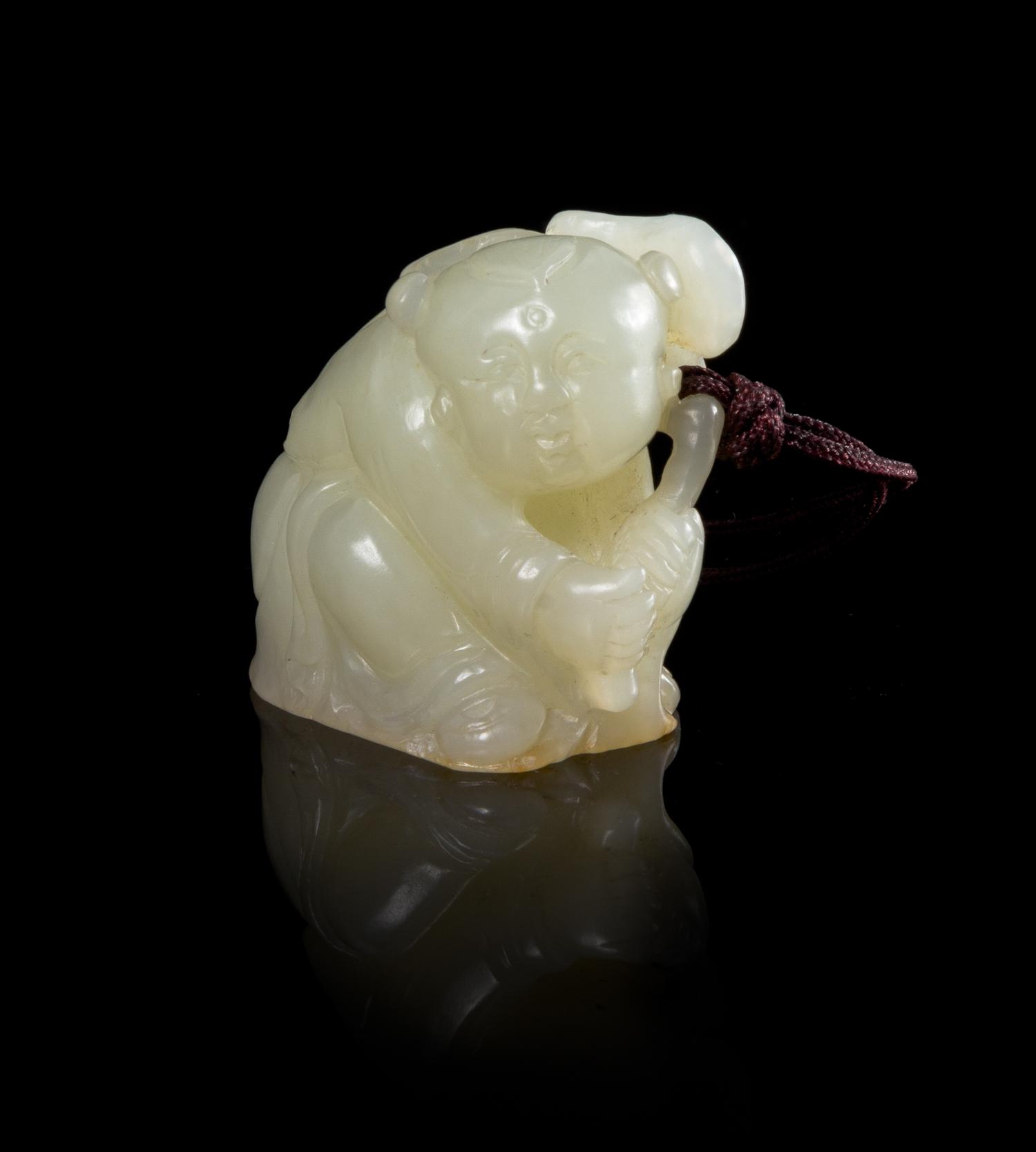 A White Jade Figure of a Boy Height 1 1/2 inches. — 18TH/19TH CENTURY