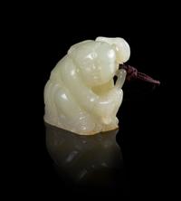 A White Jade Figure of a Boy Height 1 1/2 inches. — 18TH/19TH CENTURY