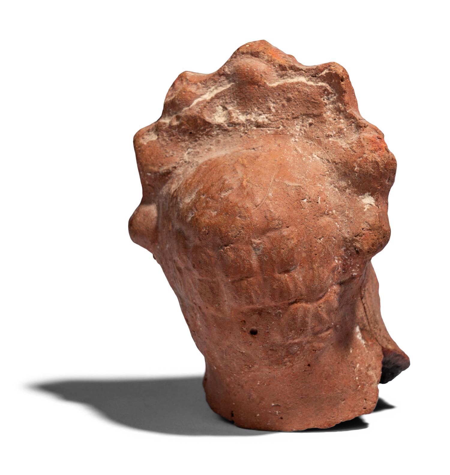 An Egyptian Terracotta Head of Serapis