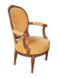 A Louis XVI Style Carved Fruitwood Fauteuil — EARLY 19TH CENTURY