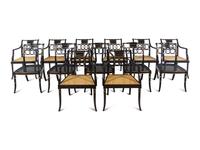Thirteen Baker Regency Style Ebonized and Parcel Gilt Cane Seat Armchairs