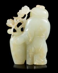 A Carved Celadon Jade Figure of a Boy Height 2 3/4 inches. — 19TH CENTURY