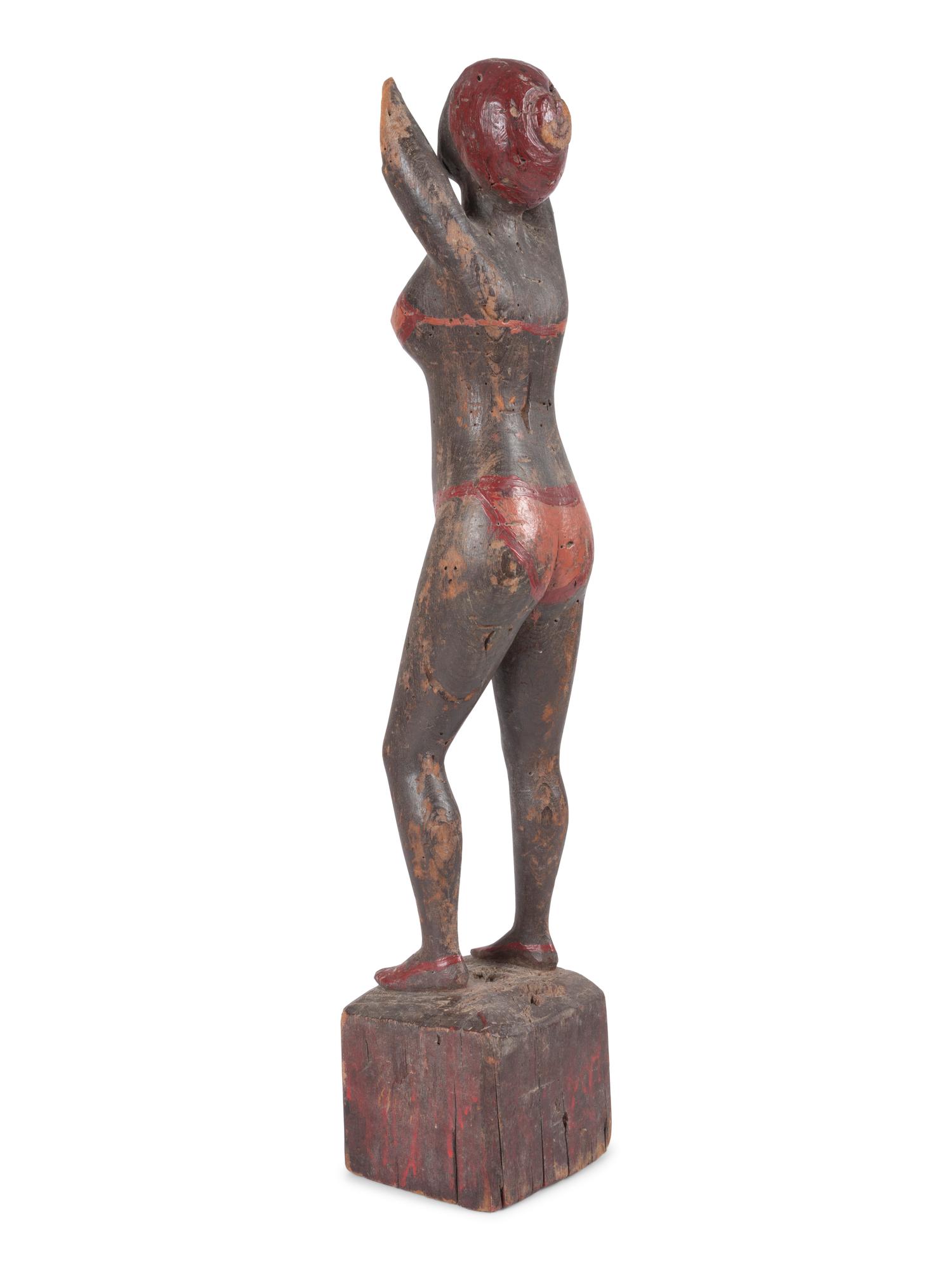A Carved and Painted Wood Bather Figure