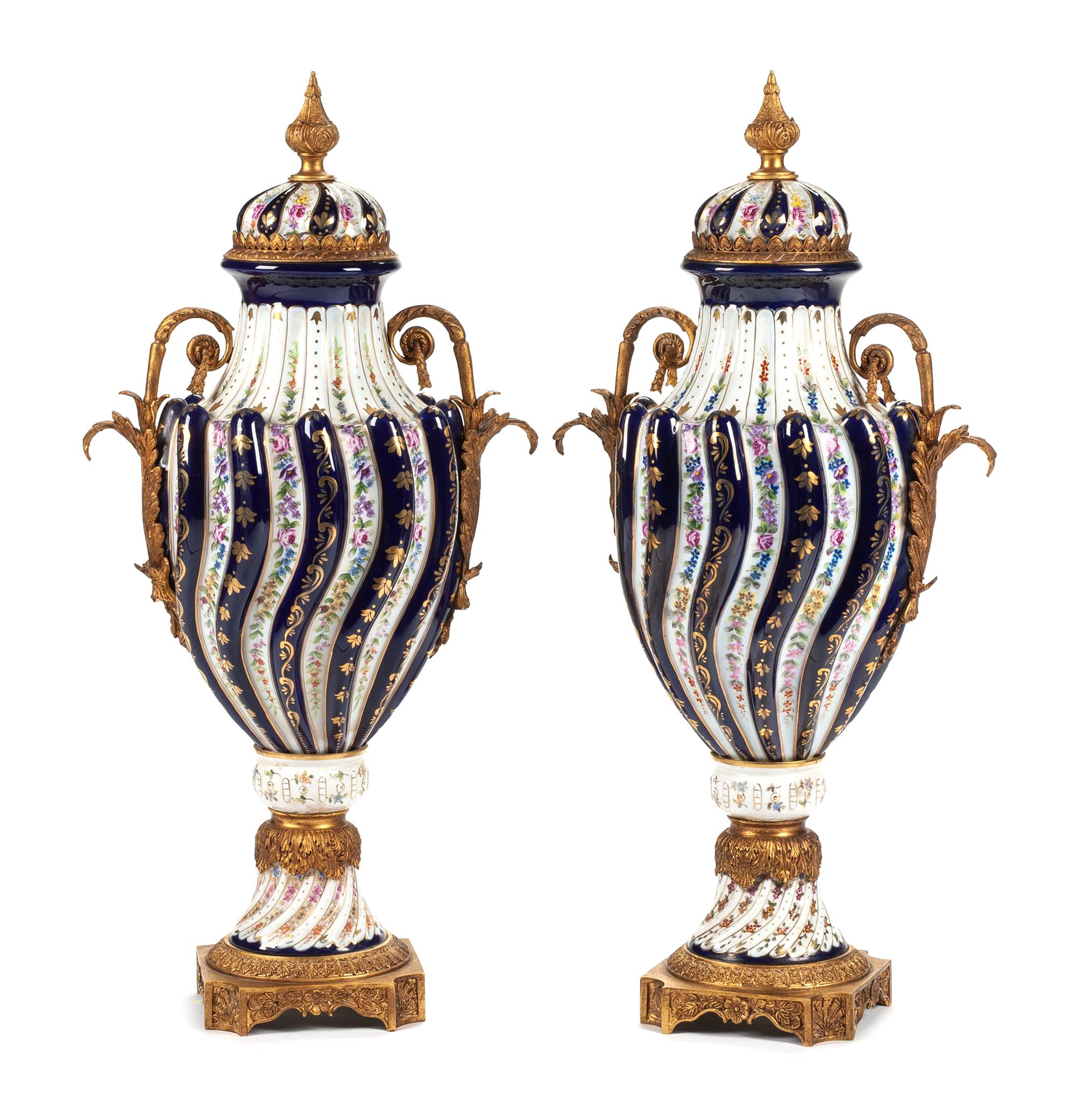 A Pair of Sevres Style Bronze Mounted Porcelain Urns Height 29 inches. — EARLY 20TH CENTURY