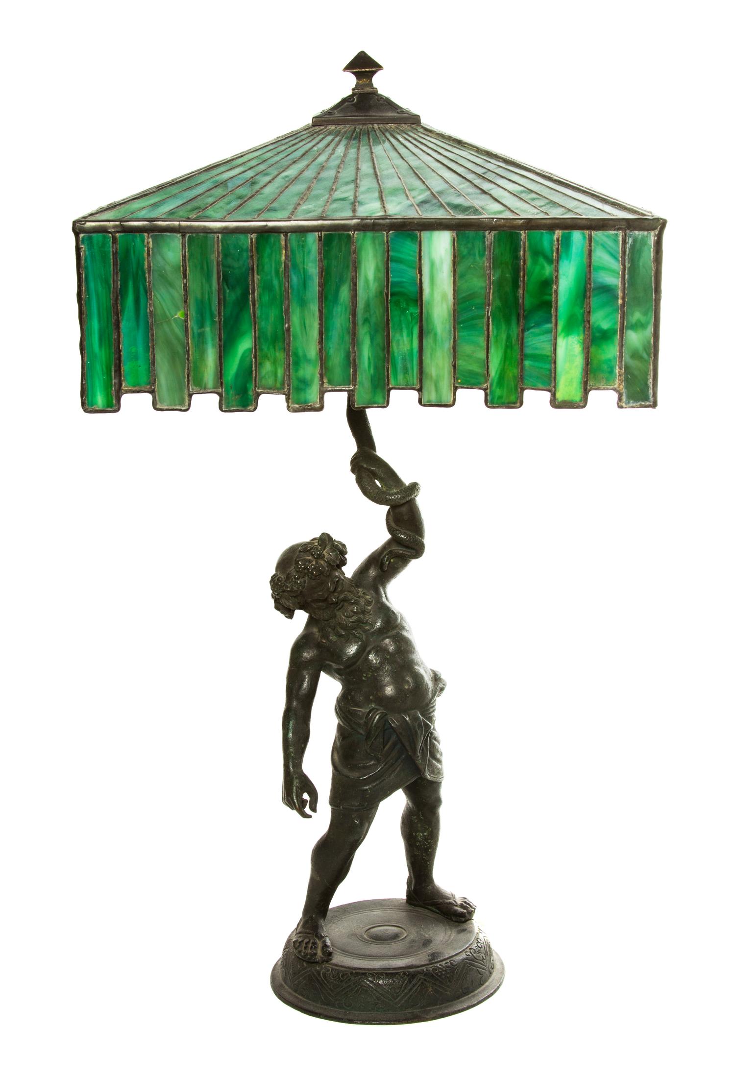 An American Leaded Glass Lamp, Height overall 26 x width of shade 14 1/4 inches.
