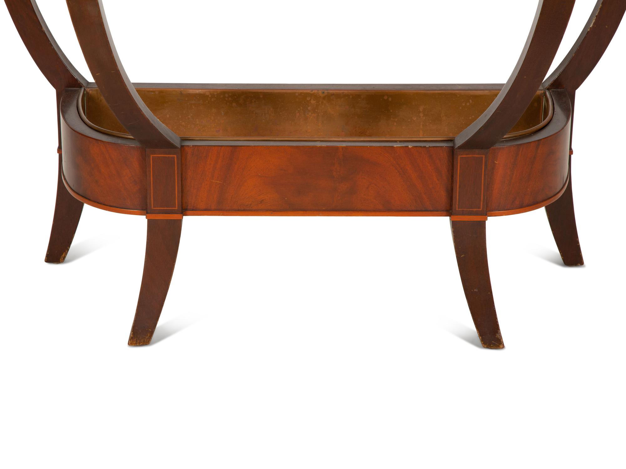 A Regency Style Inlaid Mahogany Console Table