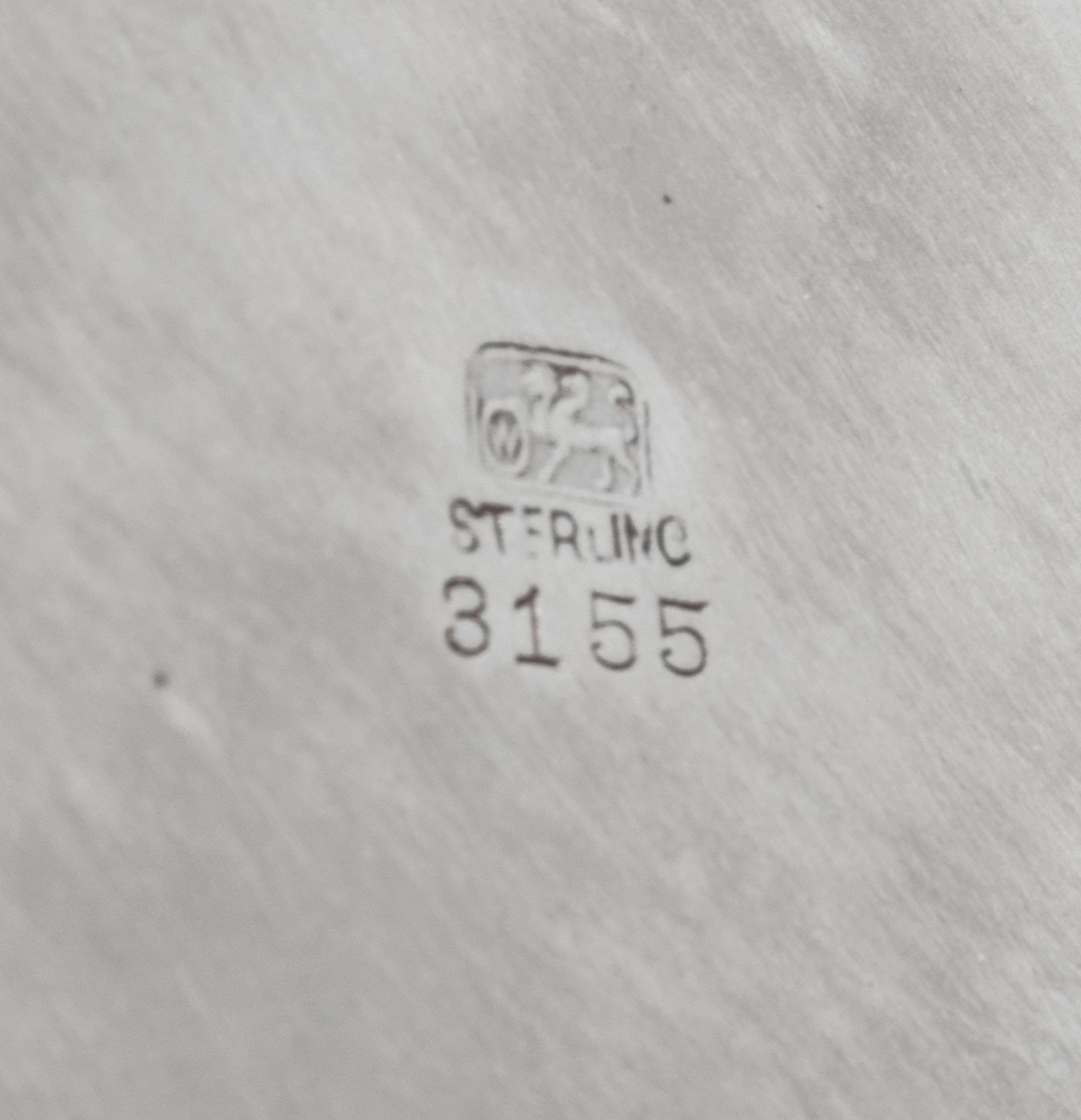 An American Silver Tray, Whiting Manufacturing Co., New York, NY, of circular form with an applied foliate scroll border, centered with