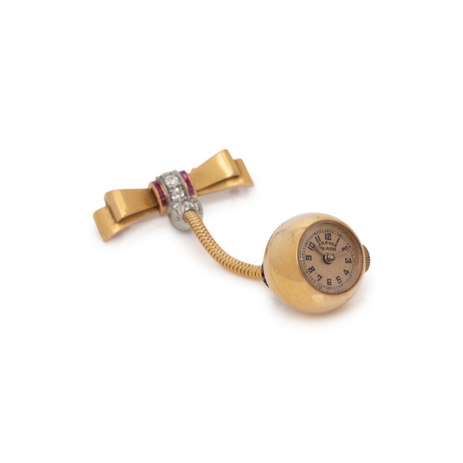 YELLOW GOLD, DIAMOND, AND RUBY WATCH BROOCH