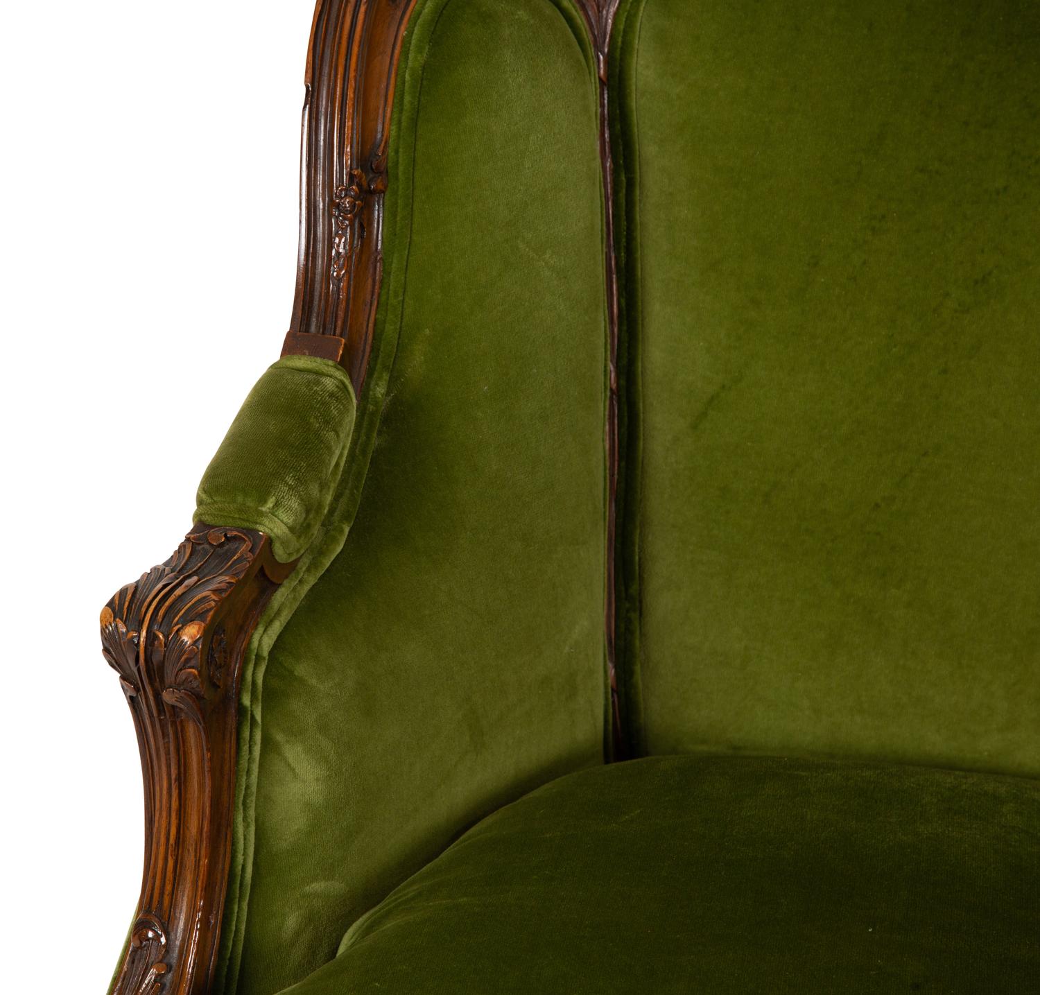 A Louis XV Style Carved Fruitwood Bergère à Oreilles
