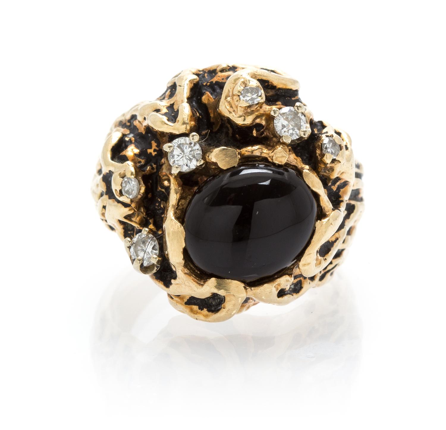 A 14 Karat Yellow Gold, Diamond and Onyx Ring, 11.30 dwts.