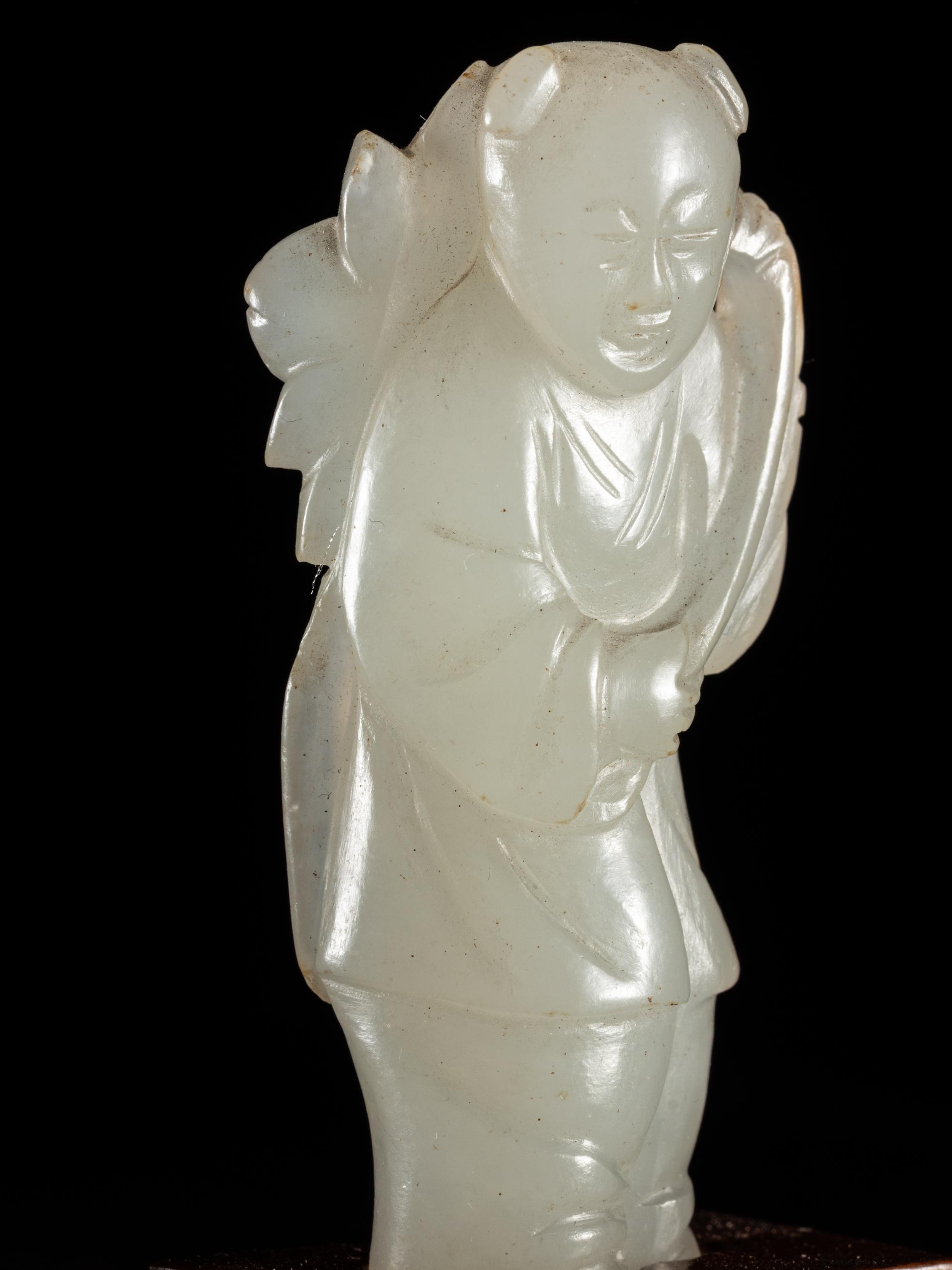Two Carved Pale Celadon Jade Figures