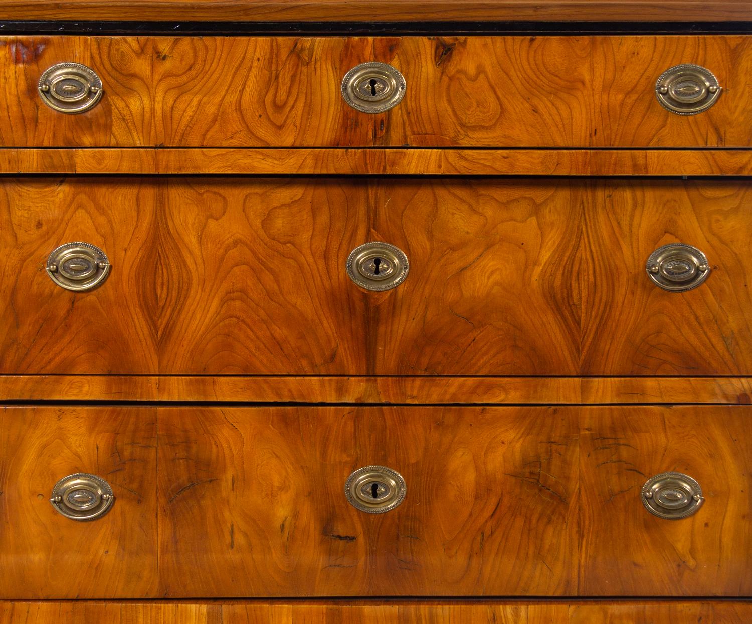 A Biedermeier Parcel Ebonized Walnut Commode