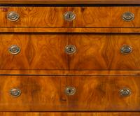 A Biedermeier Parcel Ebonized Walnut Commode