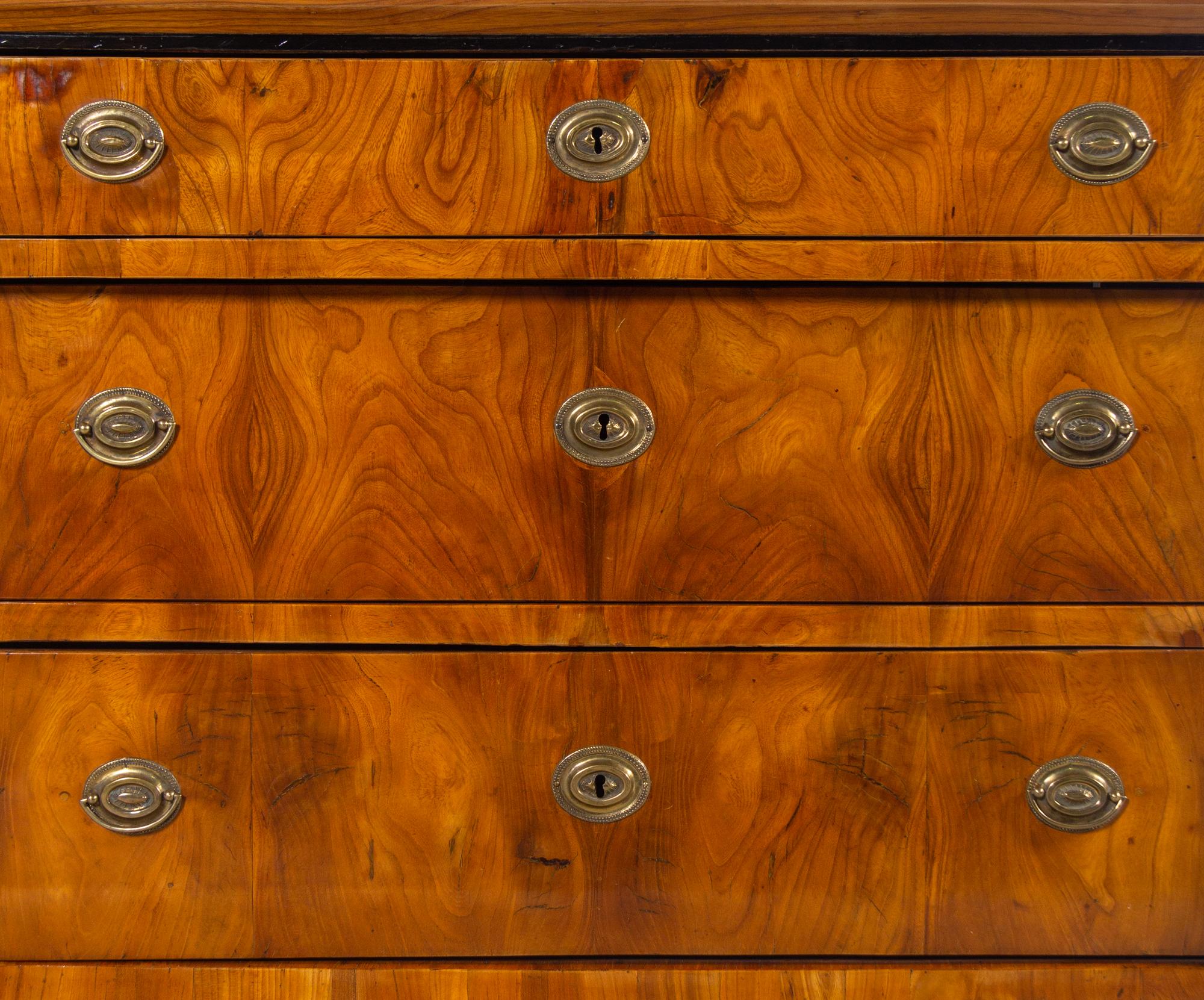 A Biedermeier Parcel Ebonized Walnut Commode
