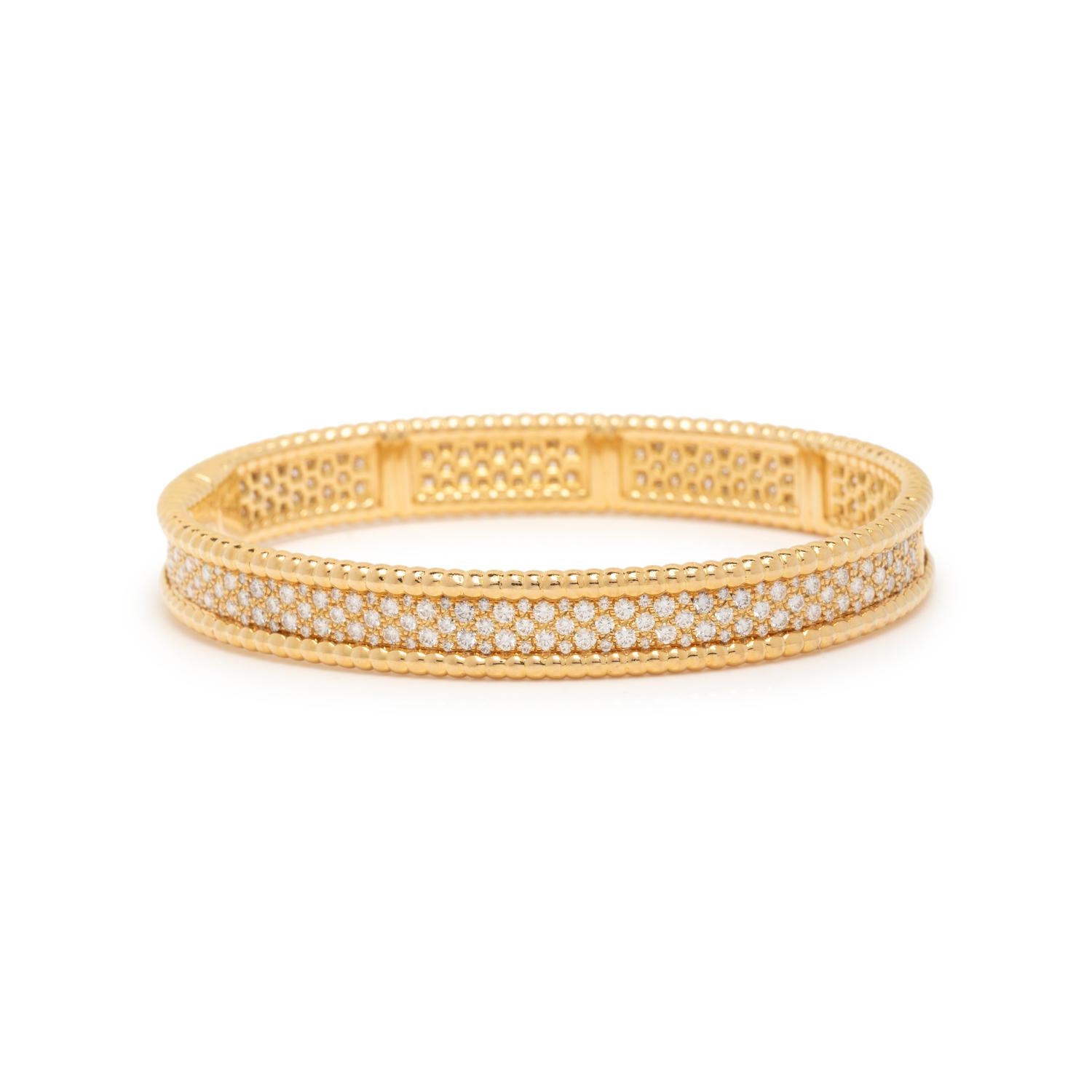 VAN CLEEF & APRELS, YELLOW GOLD AND DIAMOND 'PERLÉE' BANGLE BRACELET