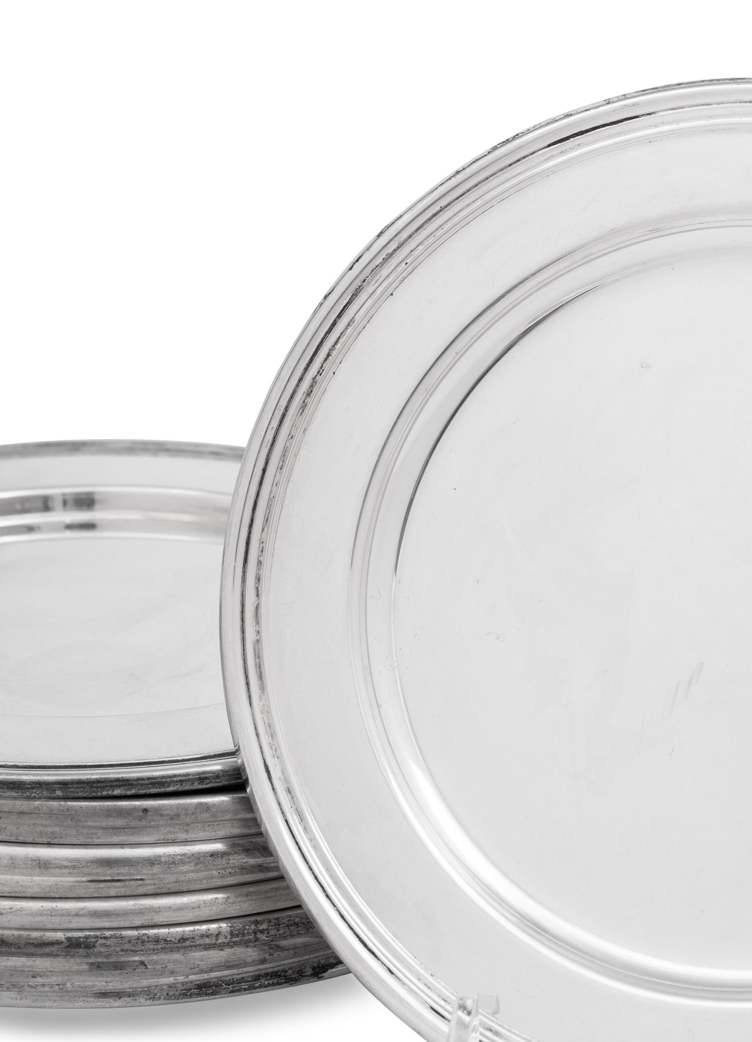 A Set of Eleven Cartier Silver Bread Plates