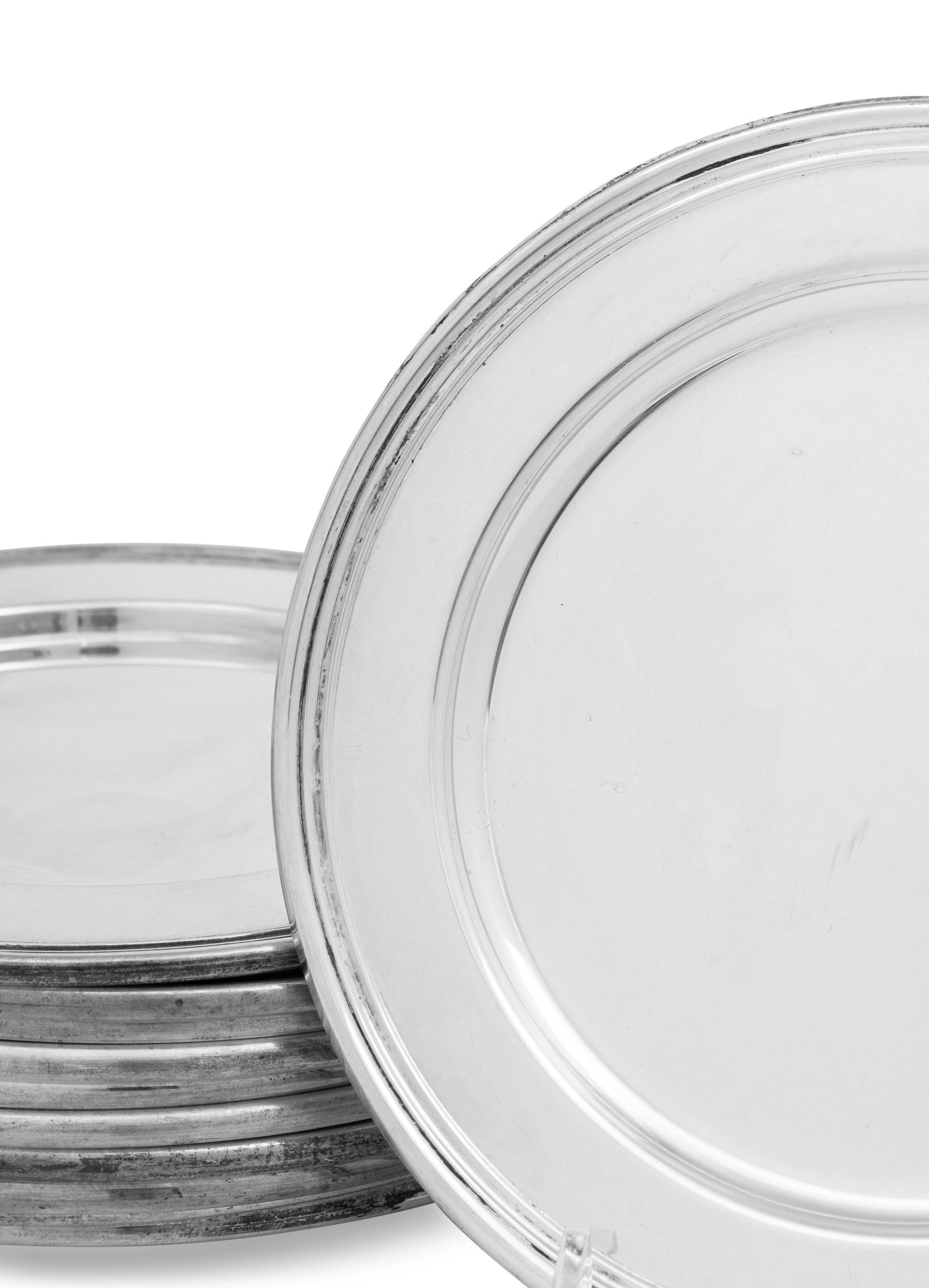 A Set of Eleven Cartier Silver Bread Plates