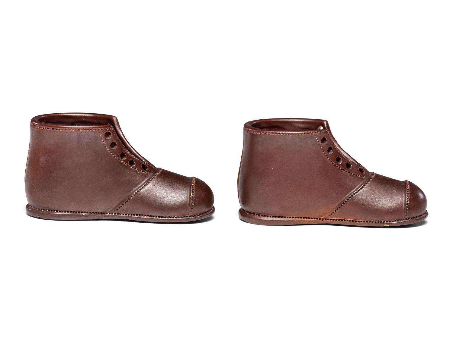 A Pair of Finely Crafted Glazed Pottery Shoes