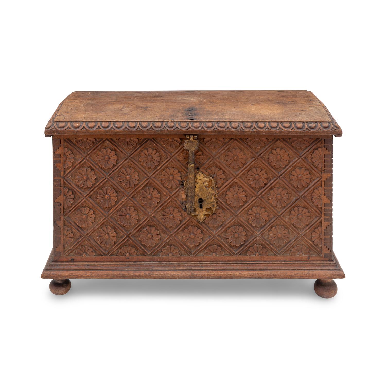A Spanish Carved Walnut and Gilt Iron Chest