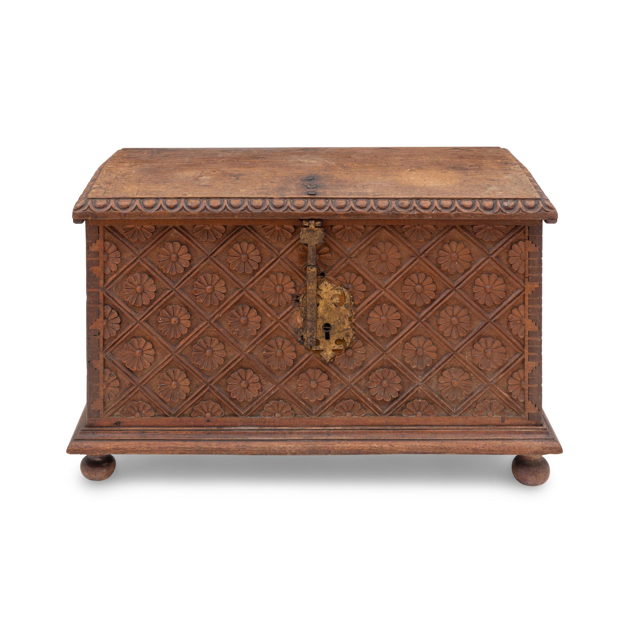 A Spanish Carved Walnut and Gilt Iron Chest