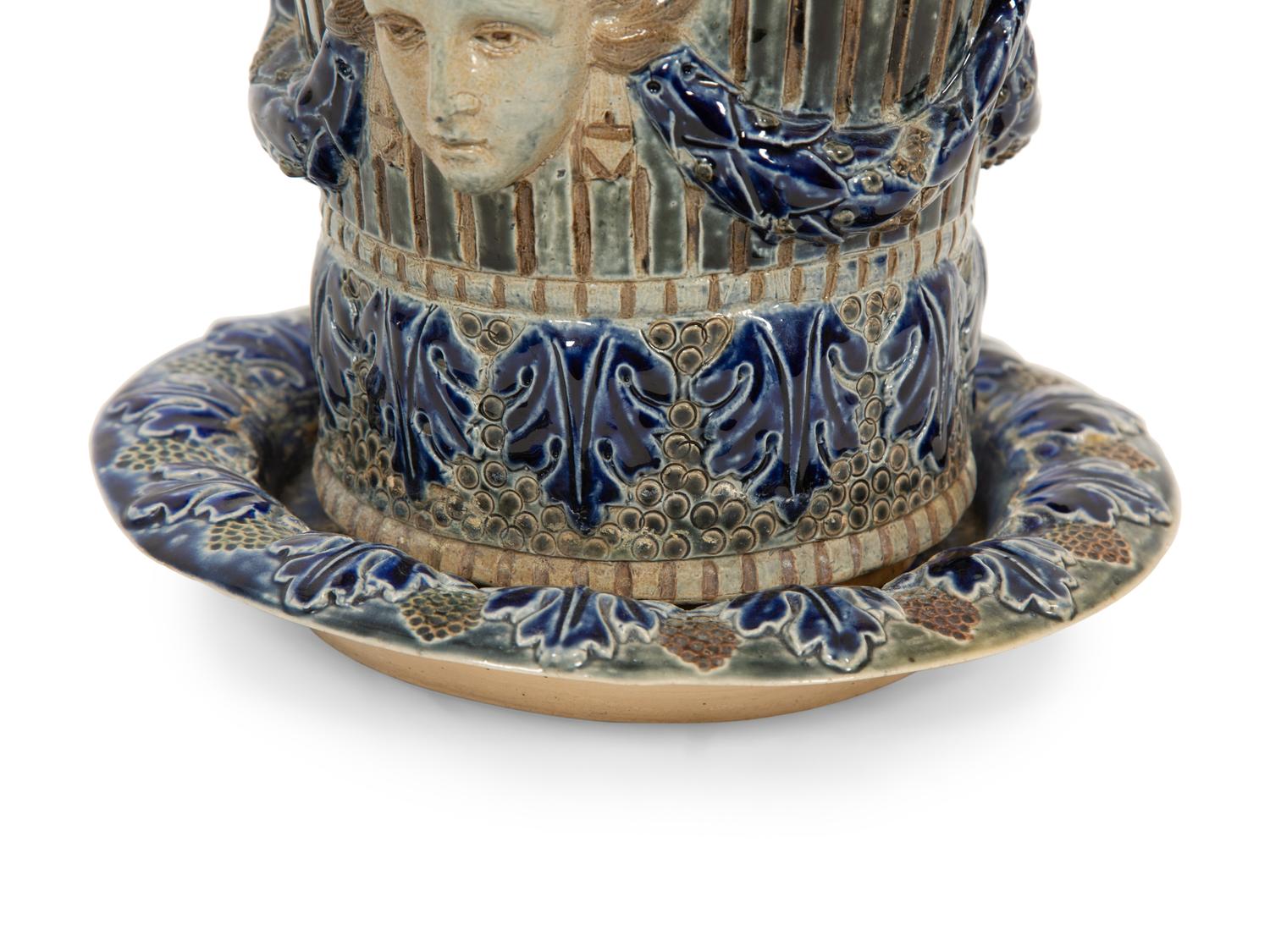 An English Majolica Jardiniere with Stand and a Cistern-form Wall Pocket
