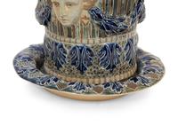 An English Majolica Jardiniere with Stand and a Cistern-form Wall Pocket