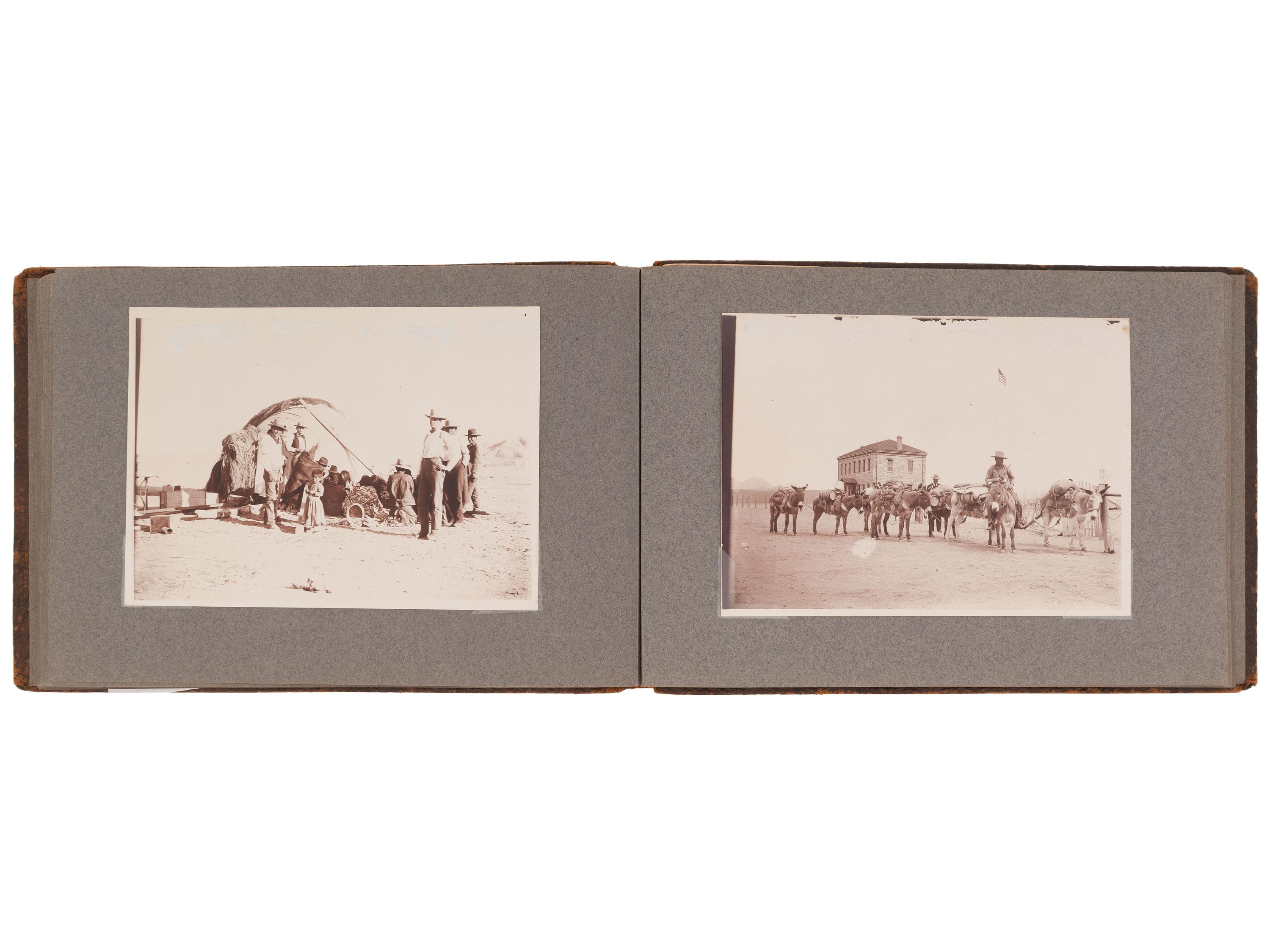 [NATIVE AMERICANS]. JONES, John Edward (1863-1922), photographer. Album containing 50 photographs of the San Carlos Indian Agency, including Apache civilians and police, agency buildings and dwellings, and scenic views. Ca 1904.