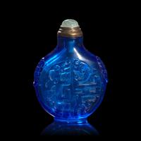 A Chinese Carved Sapphire Blue Glass "Archaistic Scrolls" Snuff Bottle