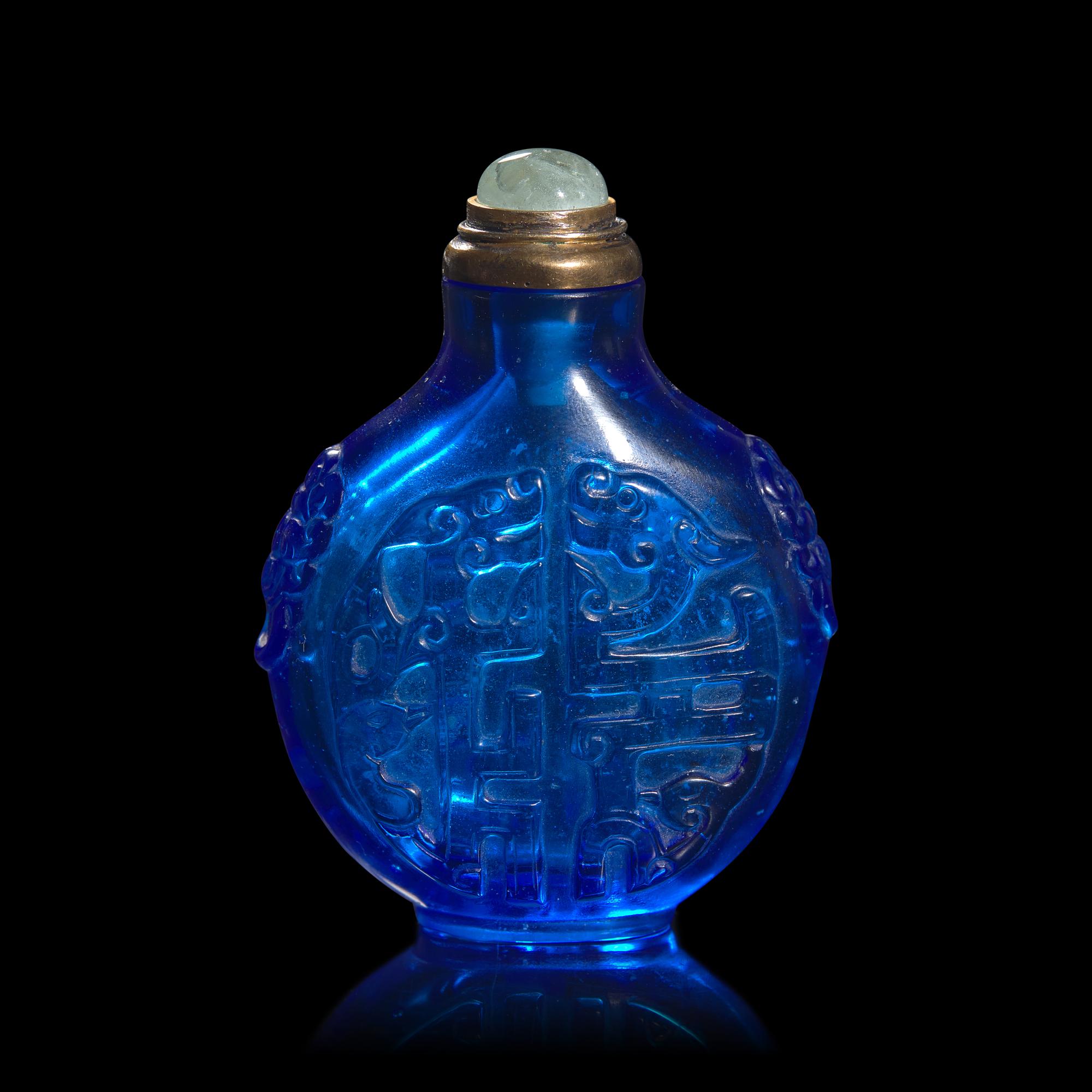 A Chinese Carved Sapphire Blue Glass "Archaistic Scrolls" Snuff Bottle