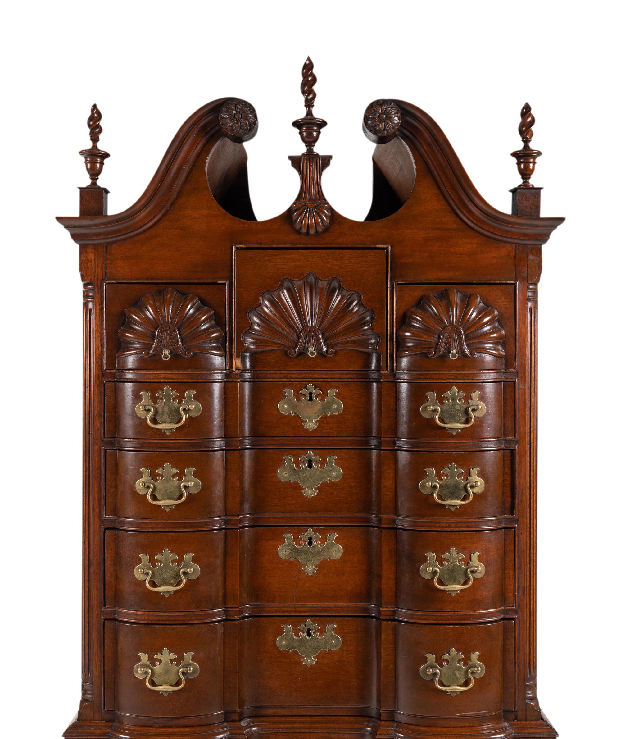 A Chippendale Style Shell and Rosette Carved Mahogany Block Front Chest-On-Chest
