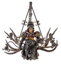 A Swiss Black Forest Carved Wood and Antler Four-Light Chandelier Height 41 x width 44 inches. — LATE 19TH CENTURY