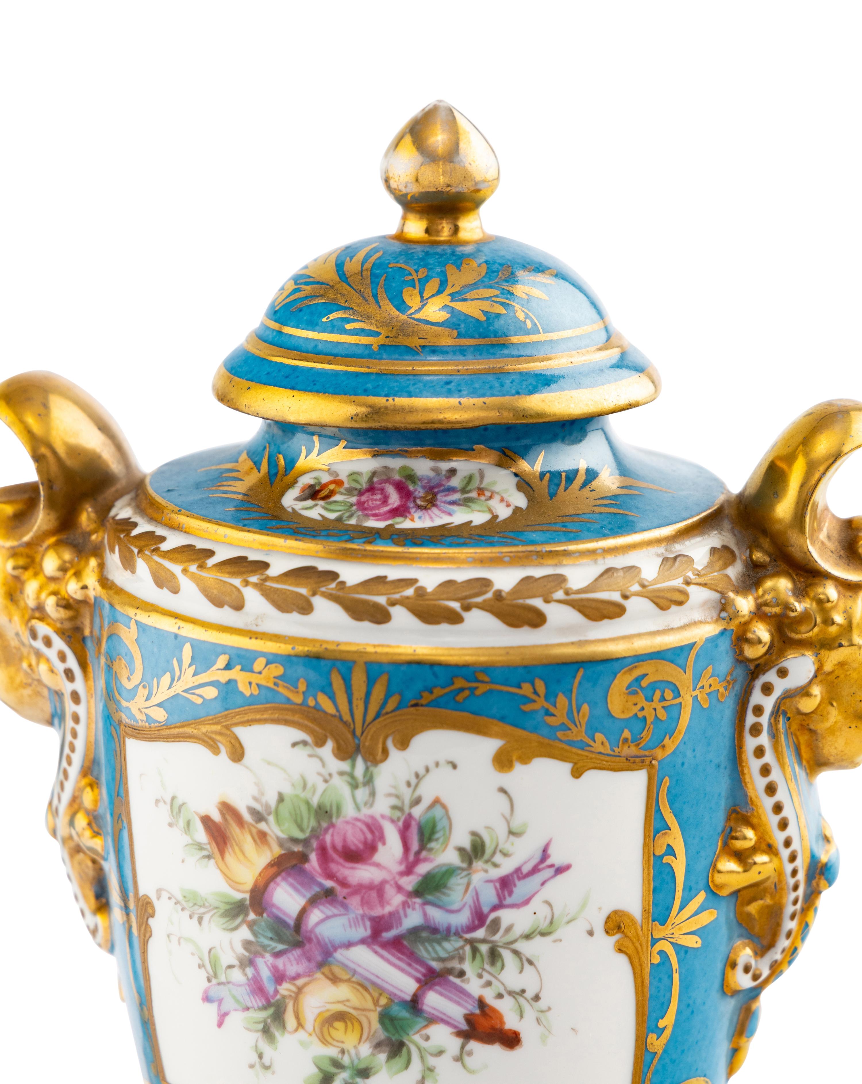 A Pair of Sèvres Style Porcelain Urns