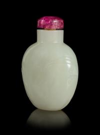A Carved White Jade Snuff Bottle Height 2 1/2 inches.