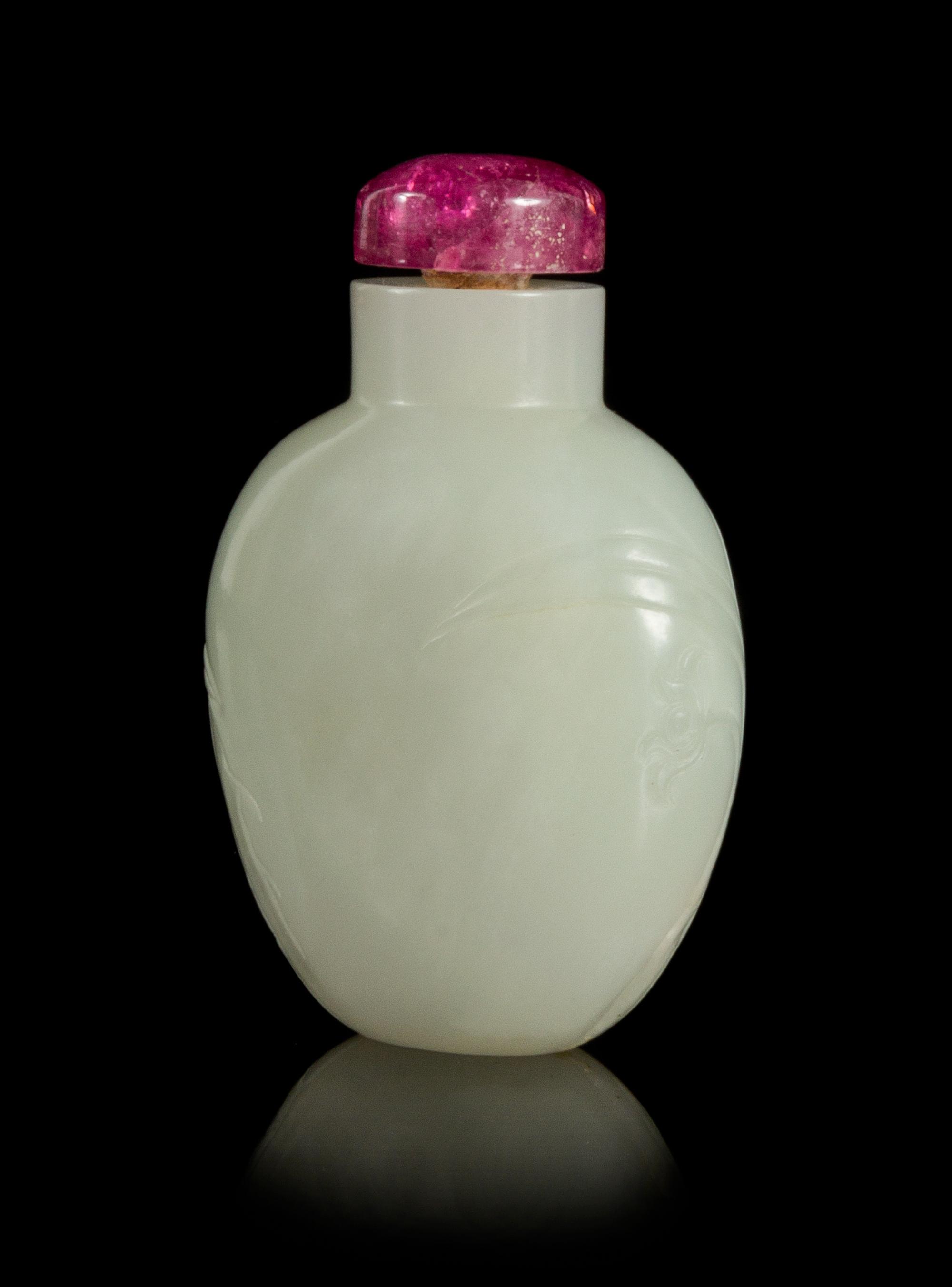 A Carved White Jade Snuff Bottle Height 2 1/2 inches.