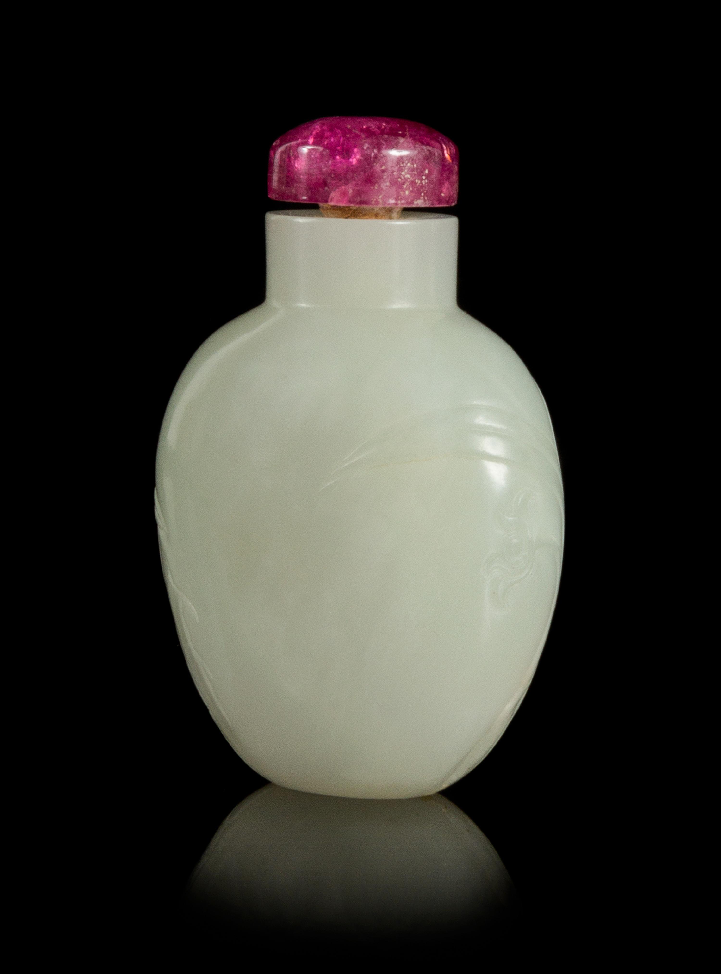 A Carved White Jade Snuff Bottle Height 2 1/2 inches.