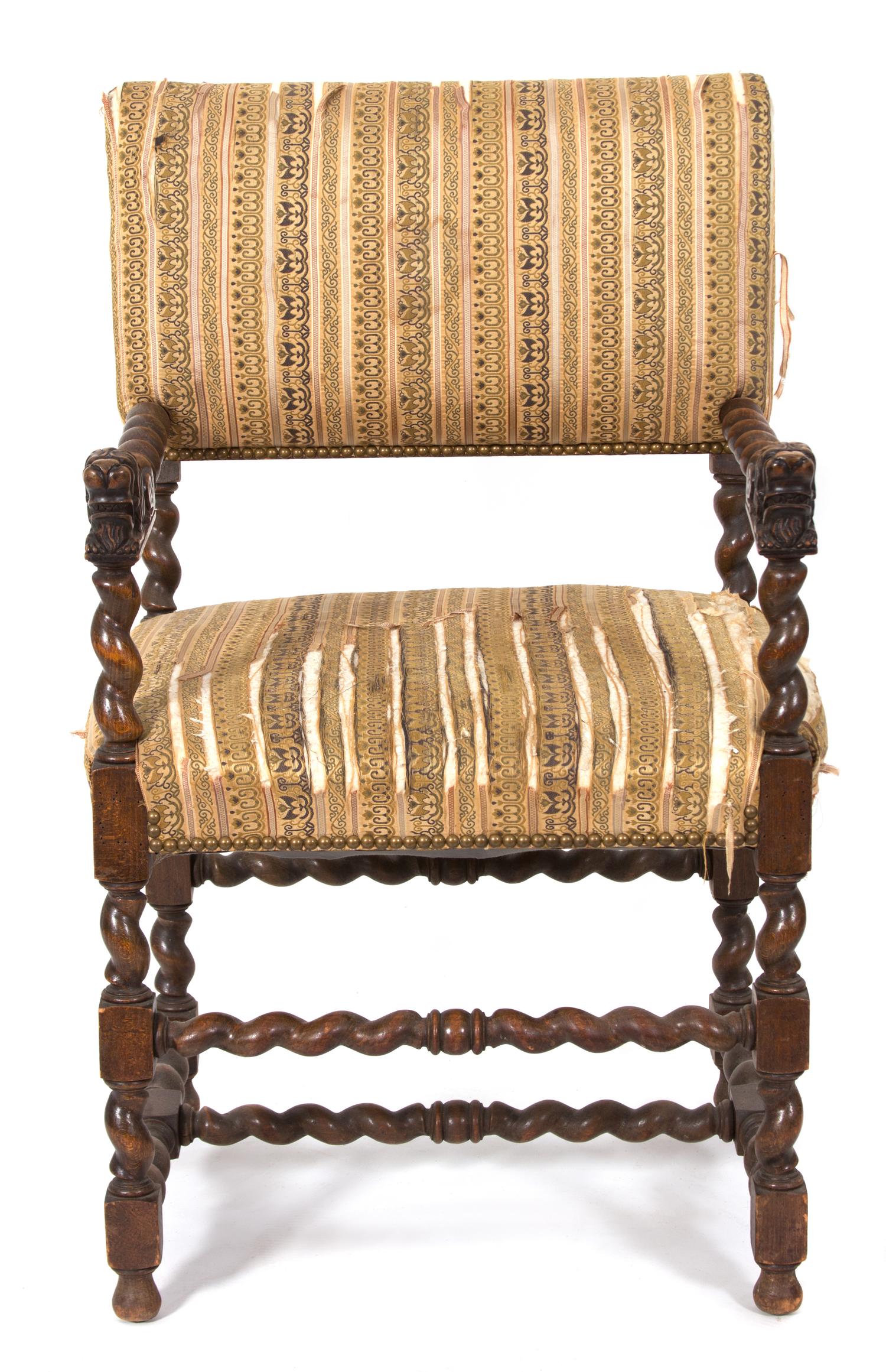 A Jacobean Style Carved Oak Armchair Height 38 1/2 inches — 19TH CENTURY