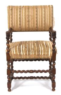 A Jacobean Style Carved Oak Armchair Height 38 1/2 inches — 19TH CENTURY