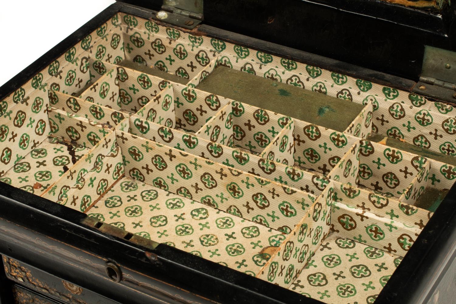 An English Mother-of-Pearl Inlaid Ebonized Cabinet