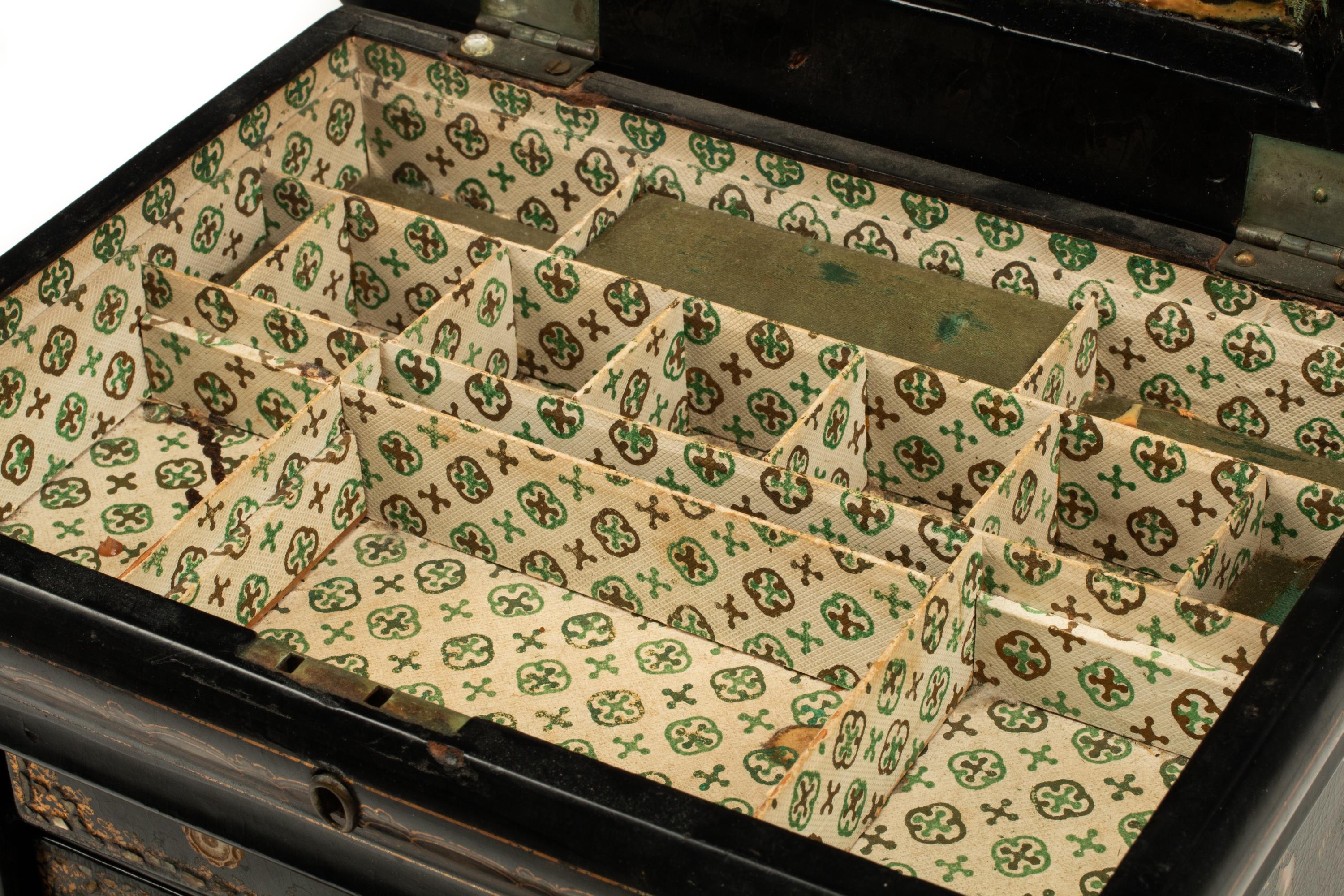 An English Mother-of-Pearl Inlaid Ebonized Cabinet