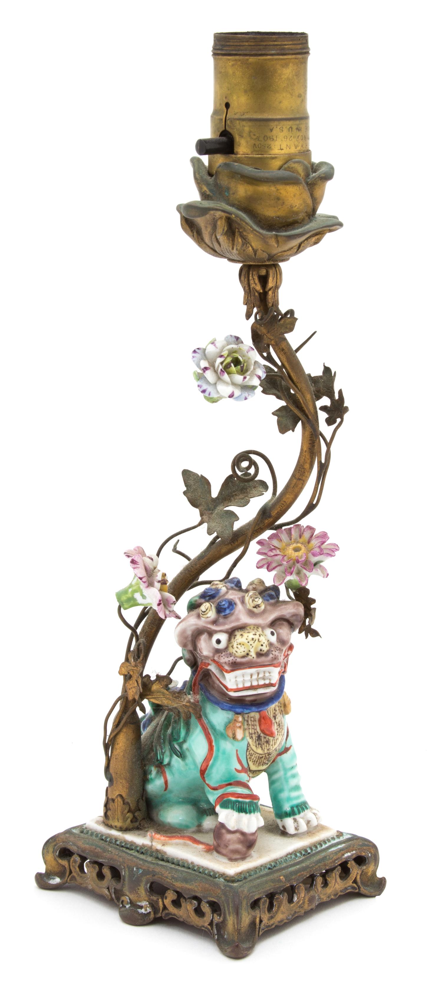 A Chinese Polychromed Decorated Porcelain Foo Dog Height 18 inches. — 19TH CENTURY