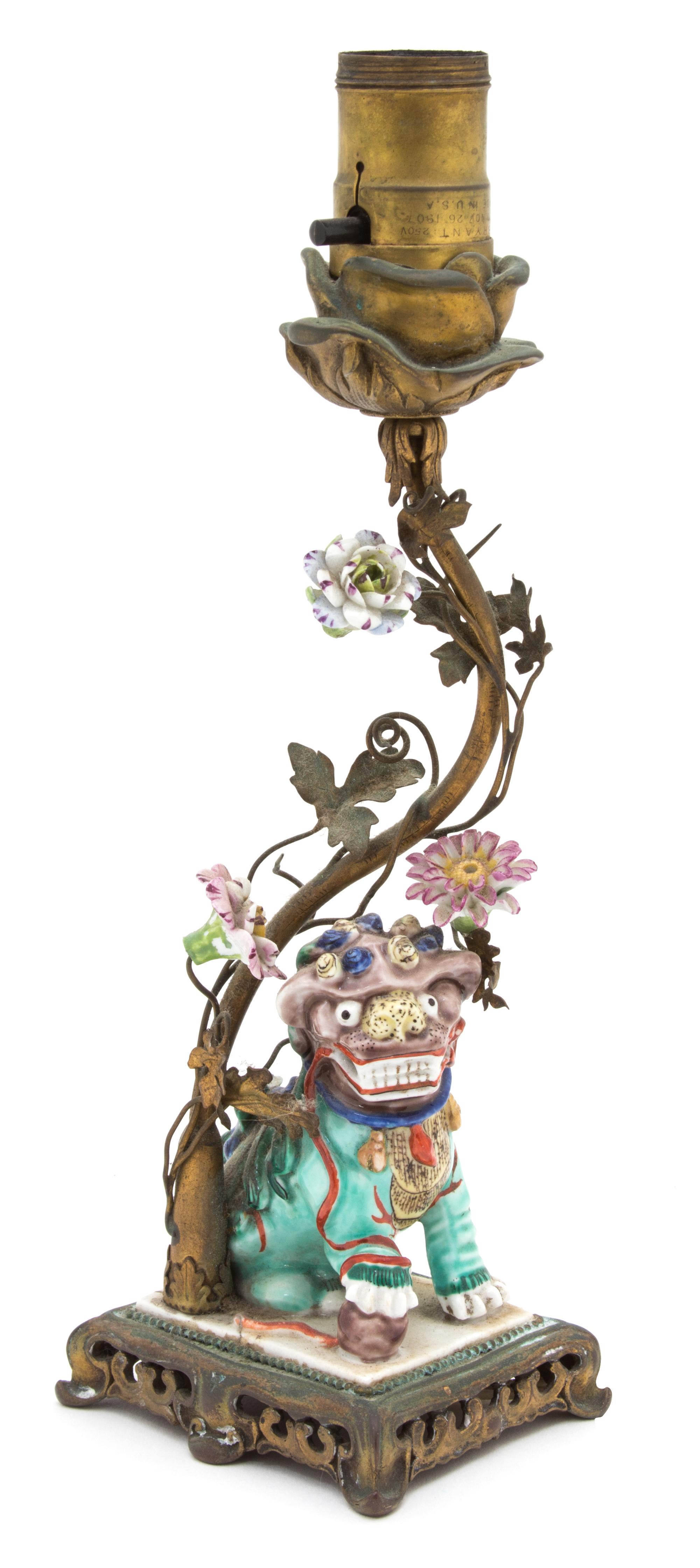A Chinese Polychromed Decorated Porcelain Foo Dog Height 18 inches. — 19TH CENTURY
