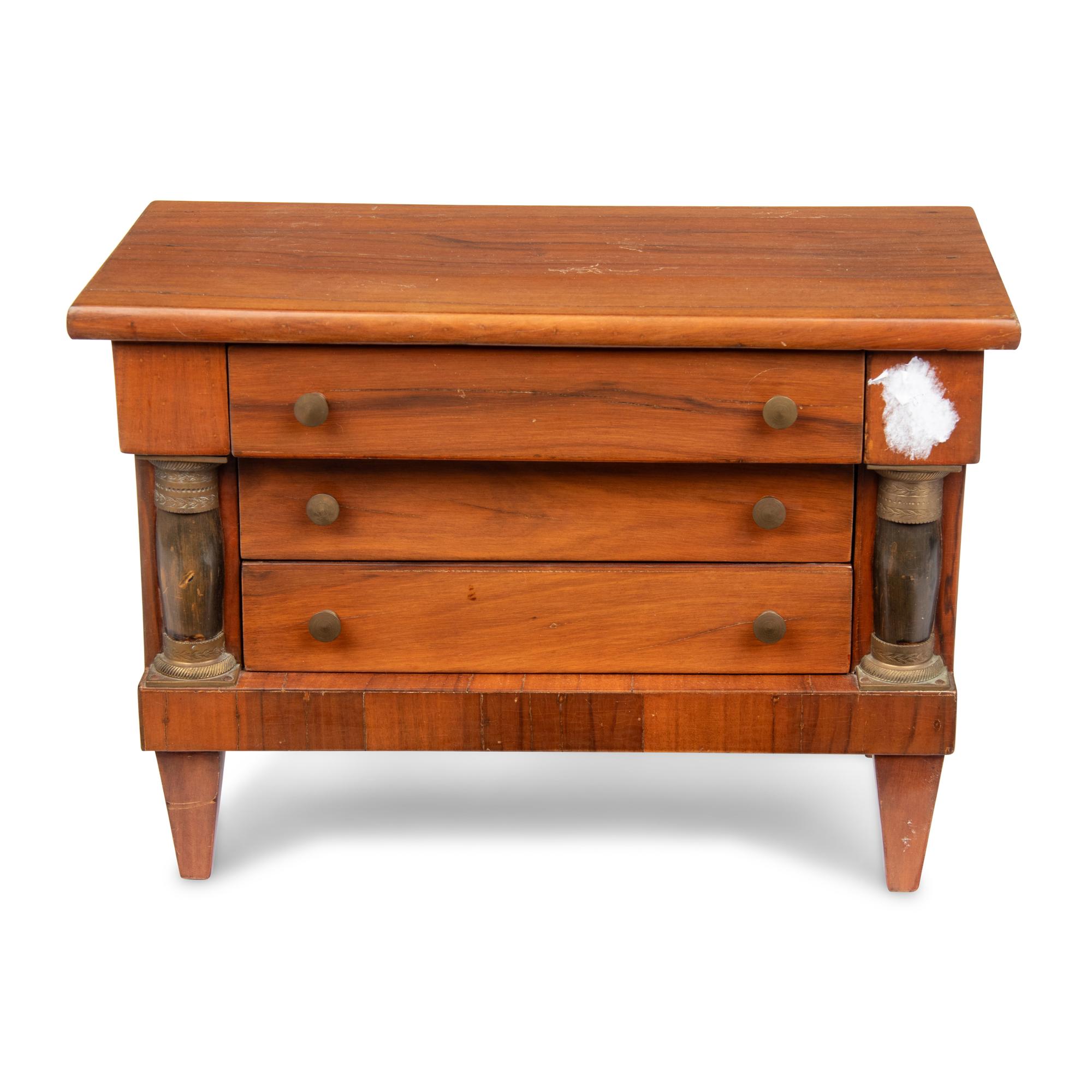 An Empire Style Diminutive Walnut Chest of Drawers