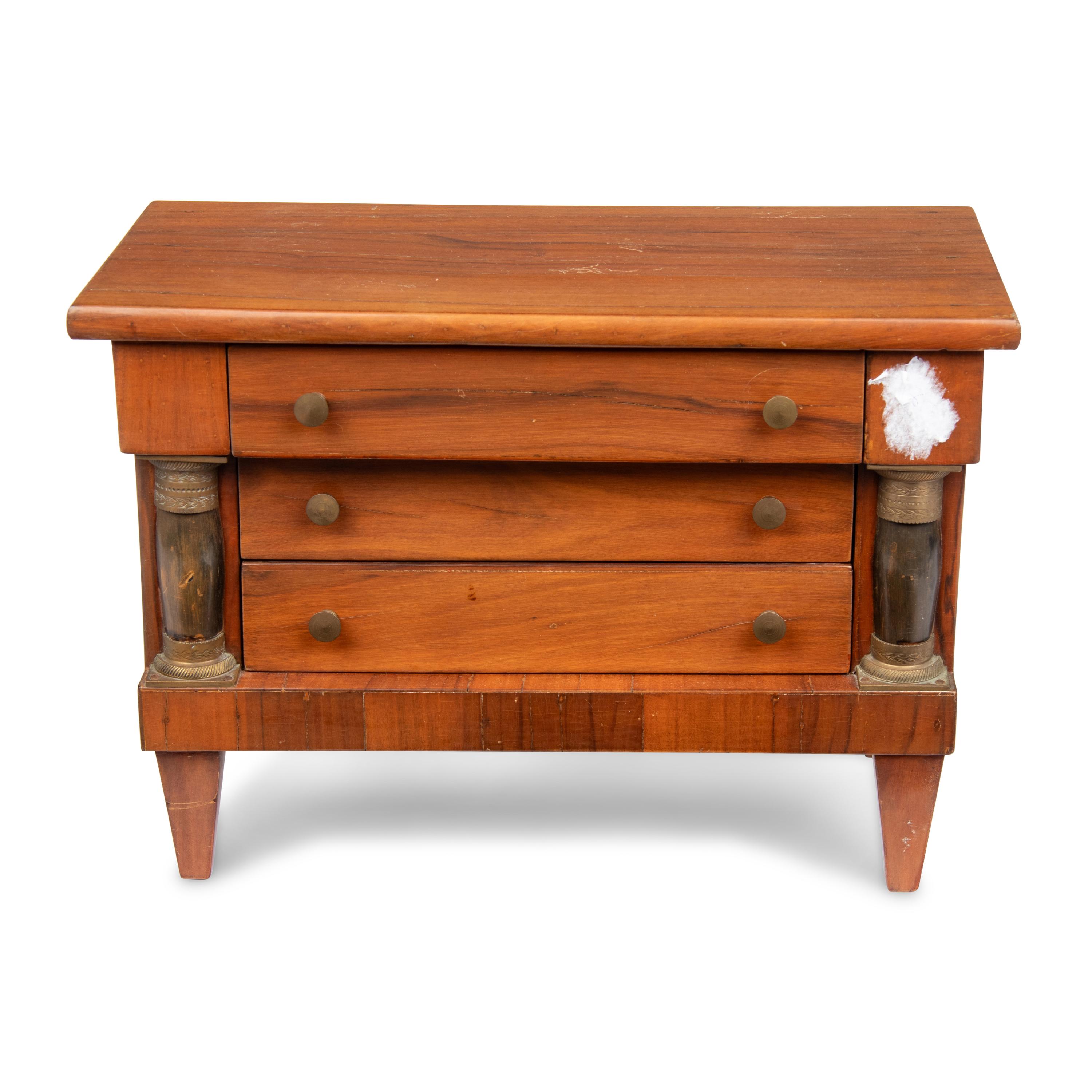 An Empire Style Diminutive Walnut Chest of Drawers