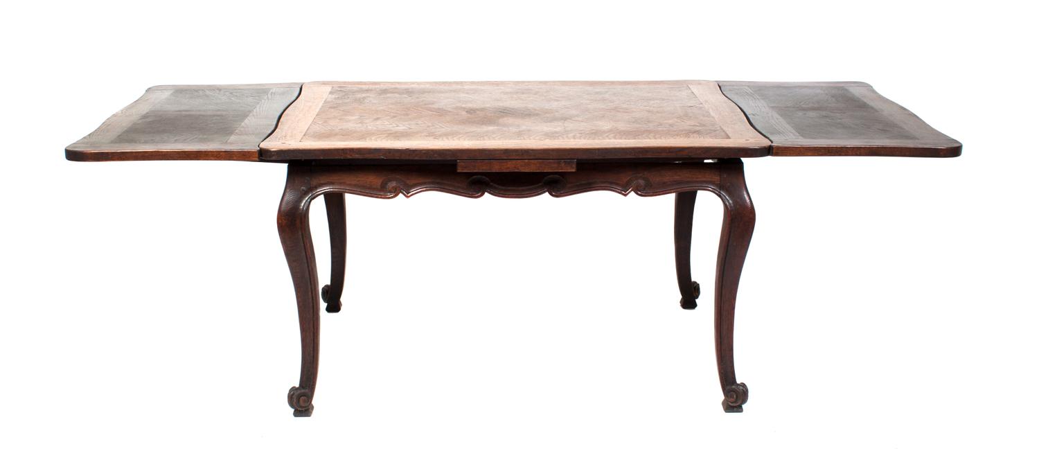 A Louis XV Style Parquetry Extension Table Height 29 1/2 x width 52 x depth 31 inches.